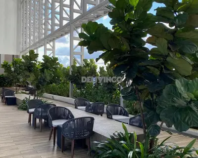 a row of chairs and tables in a building at Stylish AeroSpace Theme 1BR in KL City Center in Kuala Lumpur