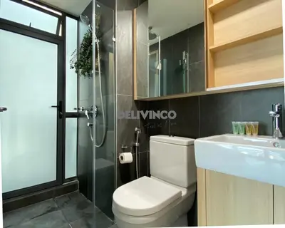 a bathroom with a toilet and a sink and a shower at The Luxe - Balcony at 42 floor - KLCC View - 3 pax in Kuala Lumpur