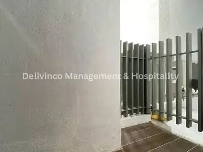 a fence on the side of a building at The Luxe Studio - 2 pax - KL - Microwave - Fridge in Kuala Lumpur