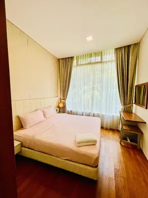 a bedroom with a large bed and a window at Vortex suites klcc by Yashrib in Kuala Lumpur