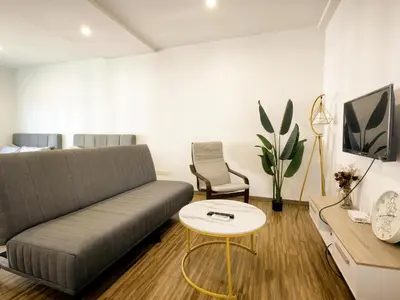 a living room with a couch and a table at Setapak Central Mall KL - Zetapark Garden Suites in Kuala Lumpur