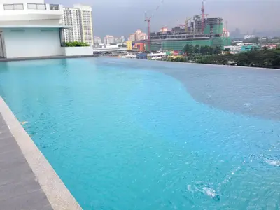 a large swimming pool on the roof of a building at Setapak Central Mall KL - Zetapark Garden Suites in Kuala Lumpur