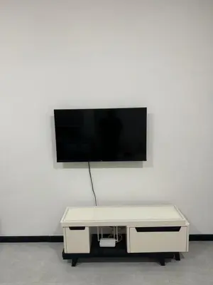 a tv sitting on top of a white wall at Neu Suites @ 3rdNvenue 003 in Kuala Lumpur