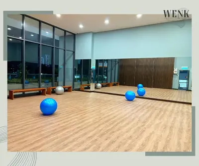 a bowling alley with blue balls on a wooden floor at Neu Suites @ 3rdNvenue 003 in Kuala Lumpur