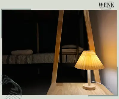 a lamp on a table in a room with a bed at Neu Suites @ 3rdNvenue 003 in Kuala Lumpur
