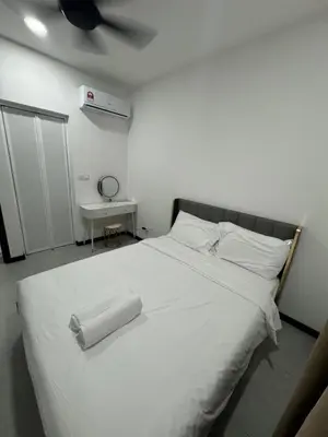 a bedroom with a white bed with a ceiling fan at Neu Suites @ 3rdNvenue 003 in Kuala Lumpur