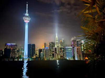 a view of a city skyline at night at Luxurious Ceylonz Suite near Bukit Bintang 4pax in Kuala Lumpur