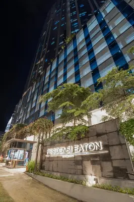 a building with a sign in front of it at Eaton Residences by Sutera at KLCC in Kuala Lumpur