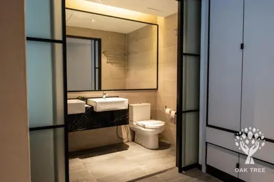 a bathroom with a toilet and a sink and a mirror at Red M101 by Oak Tree in Kuala Lumpur