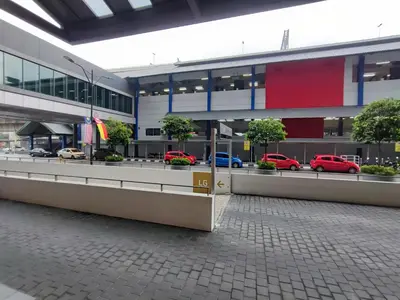 a building with cars parked in a parking lot at Datum Jelatek, Sky Ring in Kuala Lumpur