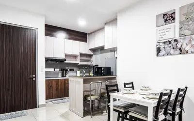 a kitchen and dining room with a table and chairs at M Vertica KL by Airhost in Kuala Lumpur