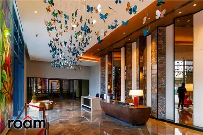a lobby with butterflies hanging from the ceiling at ViiA Residences Kuala Lumpur in Kuala Lumpur