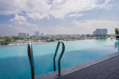 a swimming pool with a view of the city at Societe Suites By iHost Global in Kuala Lumpur