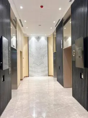 a hallway with two elevators in a building at Maxhome at Axon Bukit Bintang in Kuala Lumpur