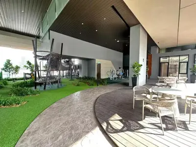 a patio with tables and chairs in a building at Maxhome at Axon Bukit Bintang in Kuala Lumpur
