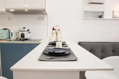 a kitchen with a counter with a plate on it at Continew 1BR High TRX Mall King Bed 100Mbps Wi-Fi in Kuala Lumpur