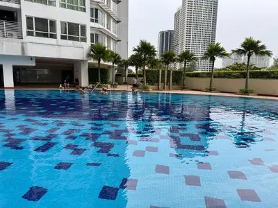 a large swimming pool in the middle of a building at HaBiBi hOmE Klcc in Kuala Lumpur