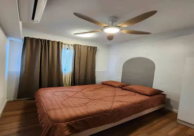 a bedroom with a bed and a ceiling fan at 5 mins to IKEA Mytown M Vertica Hanan Residence in Kuala Lumpur