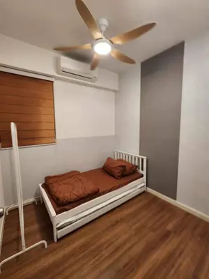 a bedroom with a bed with a ceiling fan at 5 mins to IKEA Mytown M Vertica Hanan Residence in Kuala Lumpur