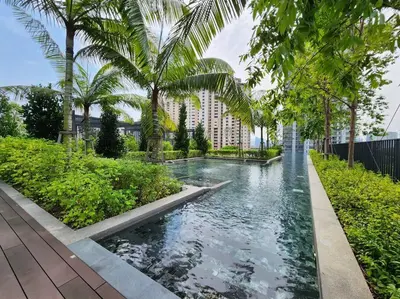 a swimming pool with palm trees and a building at The Gallery @ Pano Jln Ipoh -MRT. S/Check-In. Free Parking in Kuala Lumpur