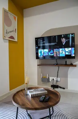a room with a table and a tv on the wall at The Gallery @ Pano Jln Ipoh -MRT. S/Check-In. Free Parking in Kuala Lumpur