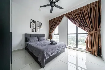 a bedroom with a bed and a ceiling fan at Peaceful 2-bedroom for 6 Pax - Chan Sow Lin in Kuala Lumpur