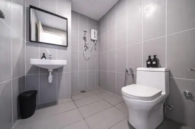 a bathroom with a toilet and a sink at Peaceful 2-bedroom for 6 Pax - Chan Sow Lin in Kuala Lumpur