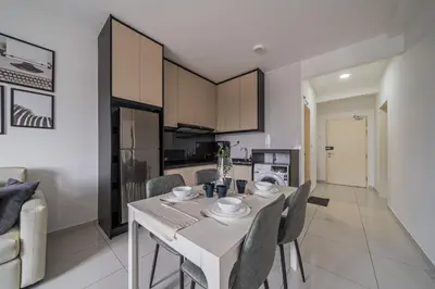 a kitchen and dining room with a table and chairs at Peaceful 2-bedroom for 6 Pax - Chan Sow Lin in Kuala Lumpur