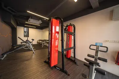 a gym with several treadmills and weights at Peaceful 2-bedroom for 6 Pax - Chan Sow Lin in Kuala Lumpur