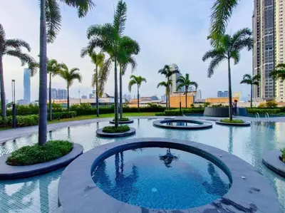 a pool in a resort with palm trees at 2Room 6pax 2 min to # Chan Sow Lin # TRX #Velocity #KLCC in Kuala Lumpur