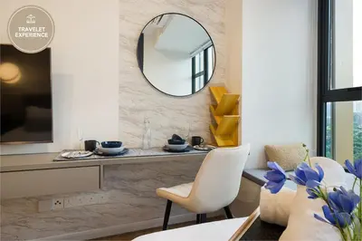 a dining room with a mirror and a table at Ceylonz Suite KLCC, Travelet in Kuala Lumpur