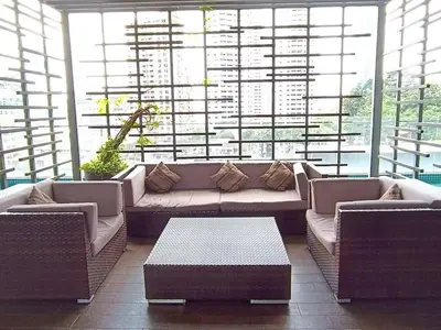a large living room with a couch and a table at RM2a18 Bukit Bintang Balcony Studio in Kuala Lumpur
