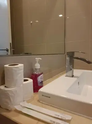 a bathroom counter with a sink and a mirror at RM203 Bukit Bintang Balcony Studio Infinity Pool in Kuala Lumpur
