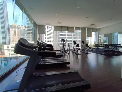 a gym with cardio equipment in a large building at RM238 Bukit Bintang Balcony Studio Infinty Pool in Kuala Lumpur