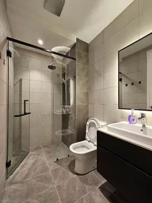 a bathroom with a toilet and a sink and a shower at The Axon Residence - Bukit Bintang Kuala Lumpur in Kuala Lumpur
