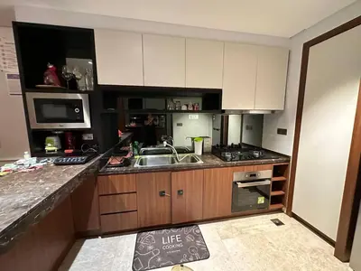 a kitchen with a sink and a counter top at Klcc studio with a rooftop garden playground in Kuala Lumpur