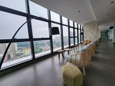 a room with chairs and tables and large windows at The Play Suite@Pano. MRT. Free Parking. Self C/In in Kuala Lumpur