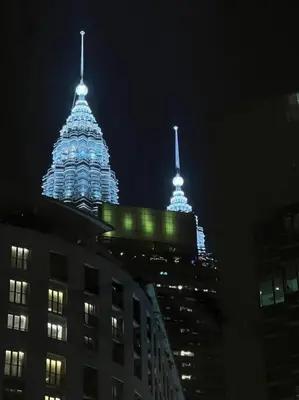 a view of a building at night with lights at Soho Suites, Centrally Located at KL City Centre in Kuala Lumpur