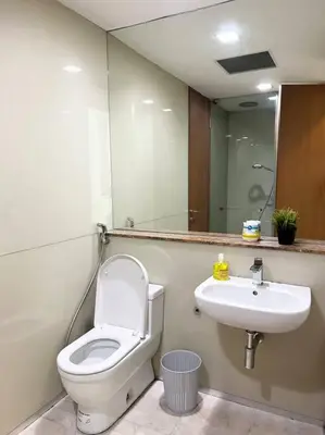 a bathroom with a toilet and a sink at Soho Suites, Centrally Located at KL City Centre in Kuala Lumpur