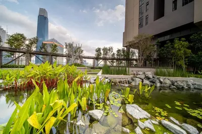 a koi pond in front of a building at Axon Residence Bukit Bintang Kuala Lumpur By Apex in Kuala Lumpur