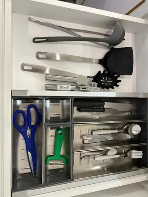 a drawer filled with scissors and other kitchen utensils at Axon Residence Bukit Bintang Kuala Lumpur By Apex in Kuala Lumpur