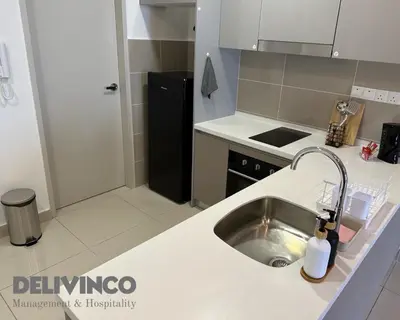 a kitchen with a sink and a counter top at Trion - 2BR - 6pax - KL - 9mins - IKEA & Velocity in Kuala Lumpur
