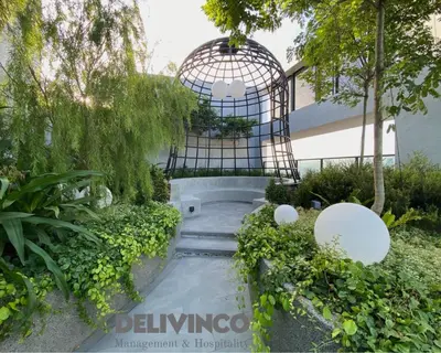 a garden with a gate and a walkway at Trion - 2BR - 6pax - KL - 9mins - IKEA & Velocity in Kuala Lumpur