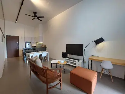 a living room with a couch and a tv at KL Sentral, Est Bangsar#11, 7Pax in Kuala Lumpur