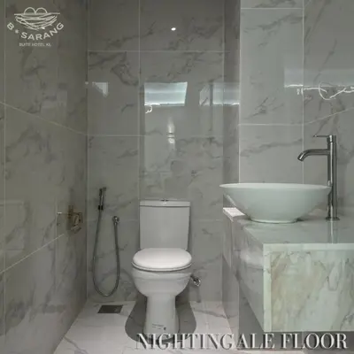 a bathroom with a toilet and a sink at B Sarang Suite Hotel Kuala Lumpur in Kuala Lumpur