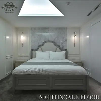 a bedroom with a king sized bed with a skylight at B Sarang Suite Hotel Kuala Lumpur in Kuala Lumpur