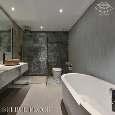 a bathroom with a bath tub and a toilet at B Sarang Suite Hotel Kuala Lumpur in Kuala Lumpur