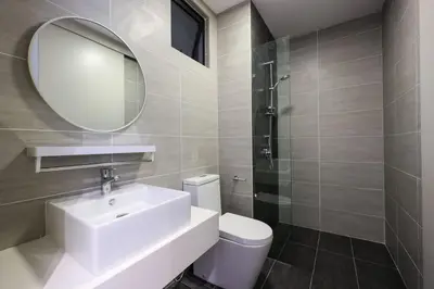 a bathroom with a sink and a mirror and a toilet at 10 min to My town family unit By Nexx Field in Kuala Lumpur