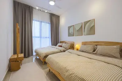 a bedroom with two beds and a window at 10 min to My town family unit By Nexx Field in Kuala Lumpur
