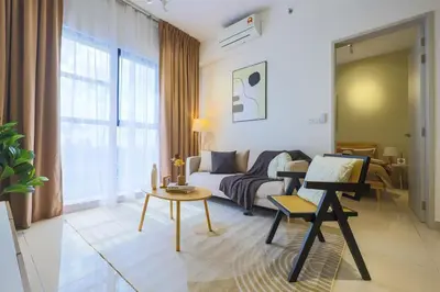 a living room with a couch and a table at 10 min to My town family unit By Nexx Field in Kuala Lumpur